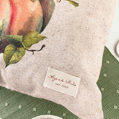 vintage pumpkin decorative pillow cover with a botanical-style pumpkin illustration in warm autumn colours.