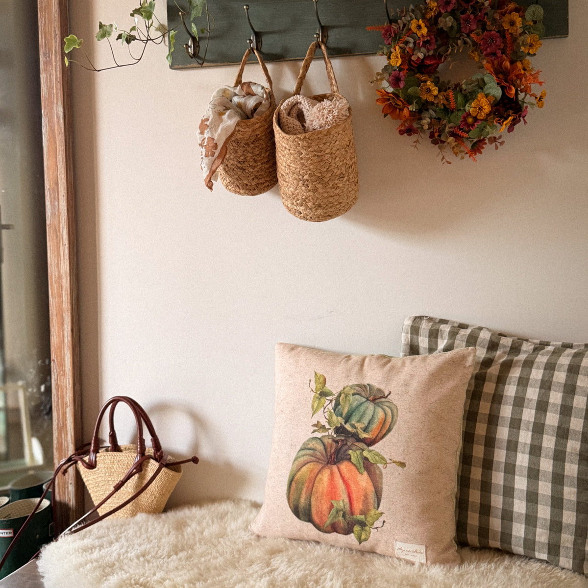 vintage pumpkin decorative pillow cover with a botanical-style pumpkin illustration in warm autumn colors in English style mudroom.