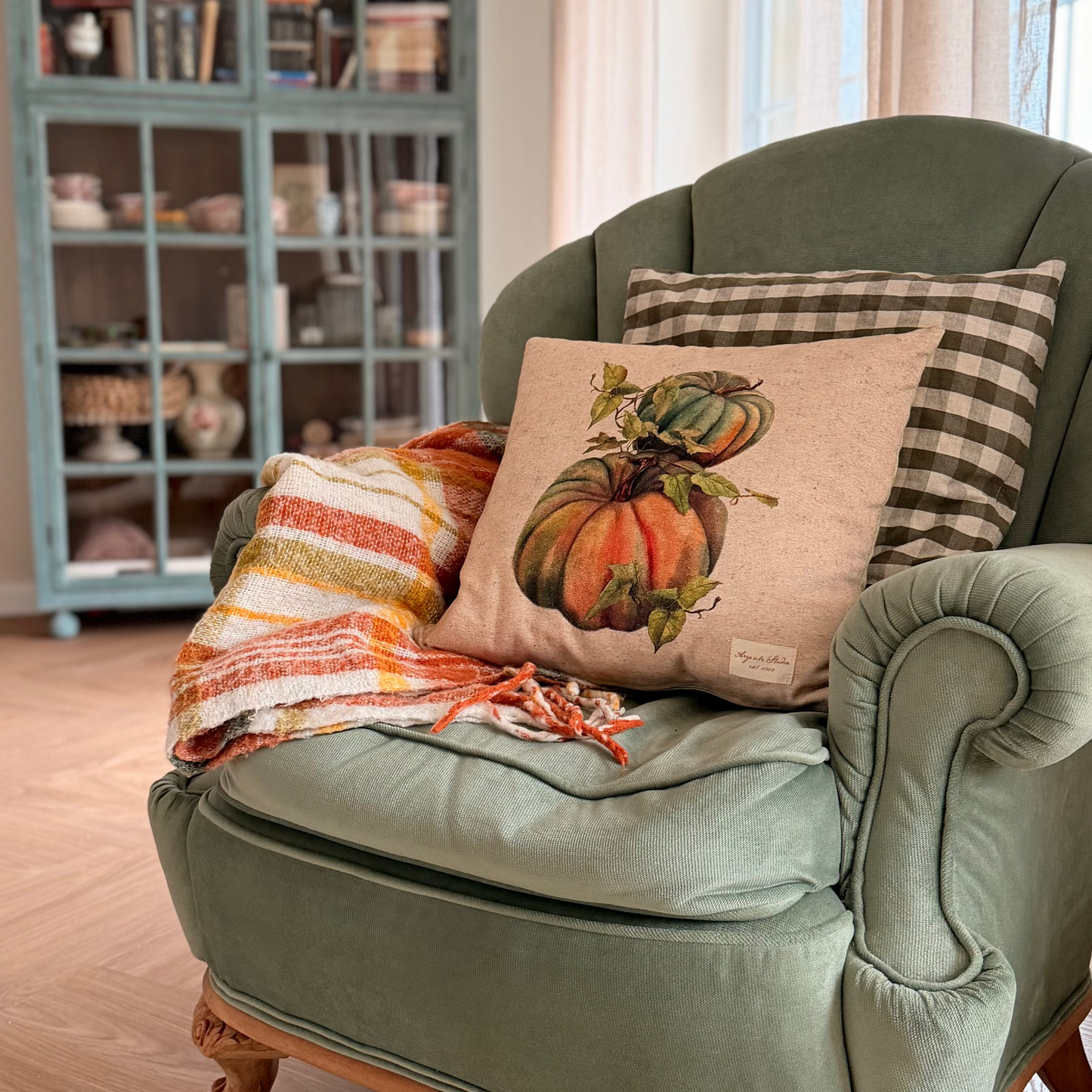 intage pumpkin decorative pillow cover with a botanical-style pumpkin illustration in warm autumn colours.