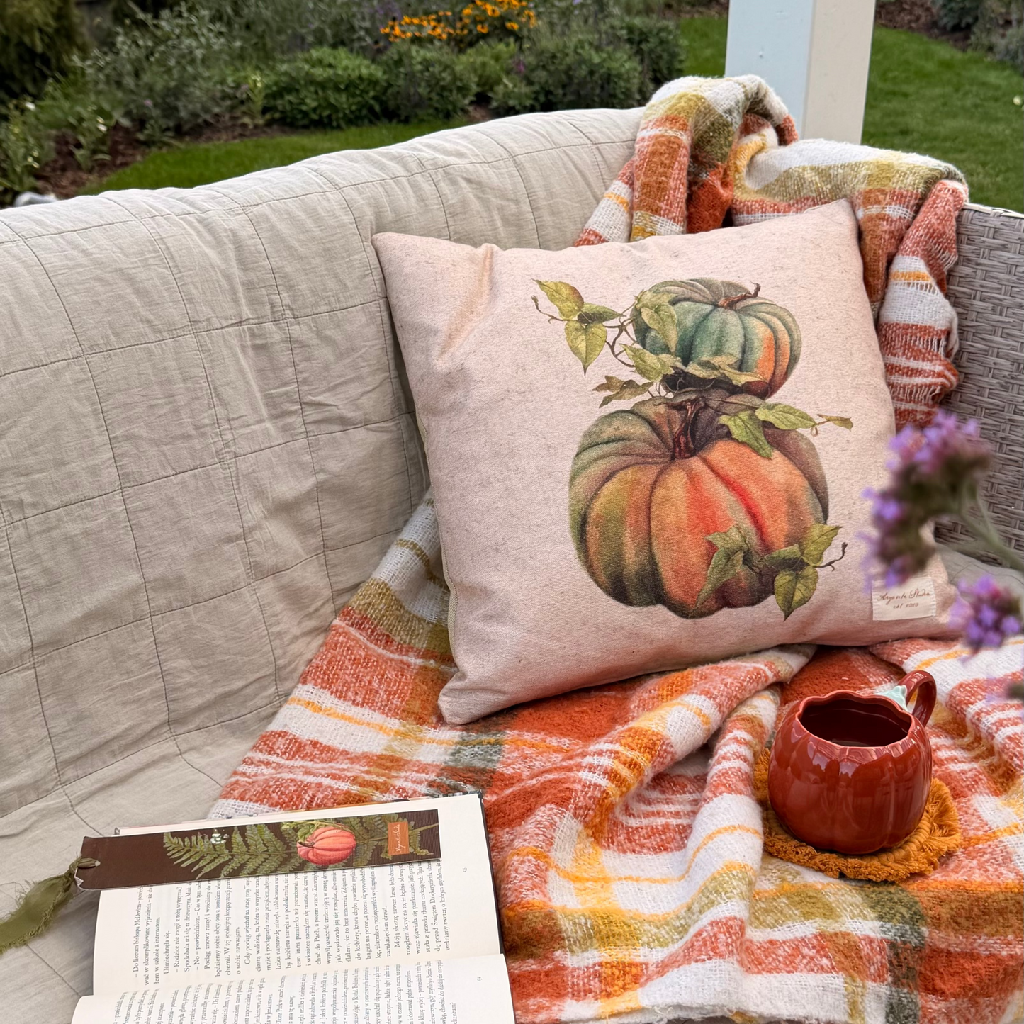 vintage pumpkin decorative pillow cover with a botanical-style pumpkin illustration in warm autumn colours in the garden